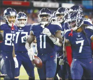 ?? Associated Press ?? Tennessee Titans wide receiver A.J. Brown (11) celebrates with teammates after scoring a touchdown against the San Francisco 49ers in the second half on Thursday in Nashville, Tenn. The Titans kicked a 44-yard field goal with 4 seconds left to edge the 49ers 20-17.