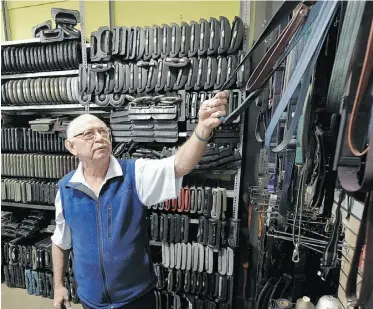  ?? JOHN LUCAS/ EDMONTON JOURNAL ?? Manager David McLean has more than 1,500 luggage handles and straps on hand at Edmonton Luggage Sales and Repair.