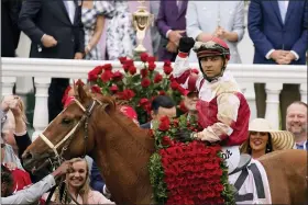  ?? JEFF ROBERSON — THE ASSOCIATED PRESS ?? Jockey Sonny Leon rides Rich Strike in the winner’s circle after winning the 148th running of the Kentucky Derby horse race at Churchill Downs on Saturday, May 7, 2022, in Louisville, Ky.