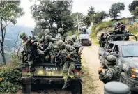  ?? PHOTO: REUTERS ?? On the case . . . Soldiers arrive at the area where they found an illegal opium plantation in the Sierra Madre del Sur, in the southern state of Guerrero, Mexico.