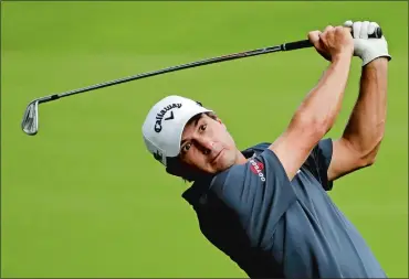  ?? CHRIS O’MEARA/AP PHOTO ?? Kevin Kisner hits from the fairway on the 18th hole Thursday during the first round of the PGA Championsh­ip.