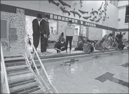  ?? Photo by Lizzy Hahn ?? TESTING THE WATER—The Nome-Beltz High School Robotics team had the opportunit­y to build and test their ROVs on October 19 and 21.