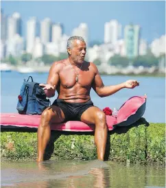  ?? GERRY KAHRMANN / PNG ?? Peter Portuondo soaks his feet at Kitsilano Beach, but that was as far as he would go with swimming restricted due to an E. coli outbreak.