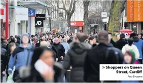  ?? Rob Browne ?? > Shoppers on Queen Street, Cardiff