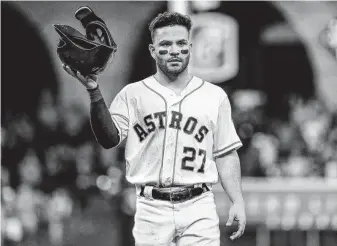  ?? Karen Warren / Staff photograph­er ?? Jose Altuve insists that even the 12-3 setback in Game 2 hasn’t dampened the Astros’ spirits. “We’re going to go out and play hard, and as soon as we start winning, we’re good,” he says.