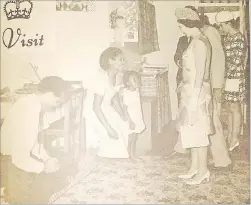  ?? Picture: FILE ?? The Queen and Irene Koroi exchange greetings as the royal party enters the Koroi family’s flat at the Raiwaqa Housing Estate in March 1970.