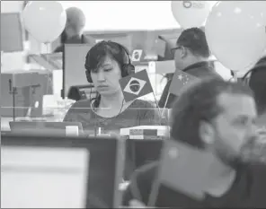  ?? PROVIDED TO CHINA DAILY ?? Employees of Didi Chuxing, China’s largest ride-hailing company, at work at their offices in Sao Paulo, Brazil.