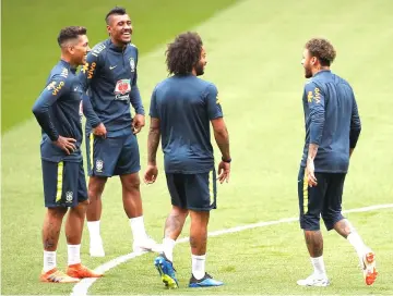  ??  ?? Brazil’s Neymar (right), Marcelo (second right)and team mates during training. — Reuters photo