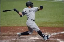  ?? CHRIS O’MEARA — THE ASSOCIATED PRESS ?? Yankees’ Rougned Odor watches his RBi single off Tampa Bay Rays relief pitcher Collin McHugh during the 10th inning.