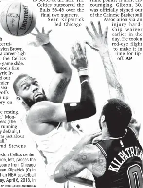  ?? AP PHOTO/ELISE AMENDOLA ?? PASS. Boston Celtics center Greg Monroe, left, passes the ball under pressure from Chicago Bulls guard Sean Kilpatrick (0) in the first half of an NBA basketball game, Friday, April 6, 2018, in Boston.