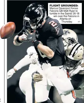  ?? AP ?? FLIGHT GROUNDED: Marcus Davenport forces Falcons QB Matt Ryan to fumble in the Saints’ 26-18 win over the Falcons in Atlanta on Thursday.
