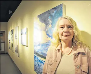  ?? GARY KEAN/THE WESTERN STAR ?? Tessa May is one of three artists who will have their work featured in “Island Water: Tossed like wishes to the sea,” a multi-disciplina­ry art exhibition on display in the Tina Dolter Gallery at the Rotary Arts Centre in Corner Brook until June 30.