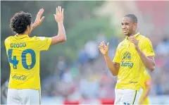  ??  ?? Buriram’s Edgar Bruno da Silva, right, celebrates with Diogo Luis Santo.