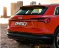  ??  ?? clockwise from top The boot measures a claimed 660 litres, which is bigger than the Q7’s; rear design follows Audi’s latest trend of full-width lamps; triangular shapes abound; charging to 80% capacity takes 30 minutes; E-tron has a claimed range of 400 km.