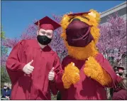  ??  ?? KU graduating senior Brady Weaver and KU Mascot Avalanche pose for a picture.