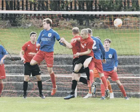  ??  ?? Action from Horden (red) v Darlington Town (blue) last weekend.