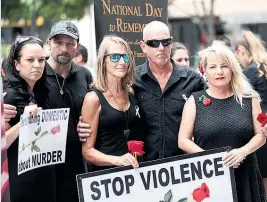  ?? Picture / News Ltd ?? Natalie Hinton and Jon Gardner with family and friends outside the court in a show of support and protest against violence.