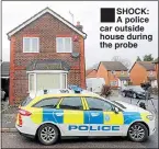  ??  ?? SHOCK: A police car outside house during the probe