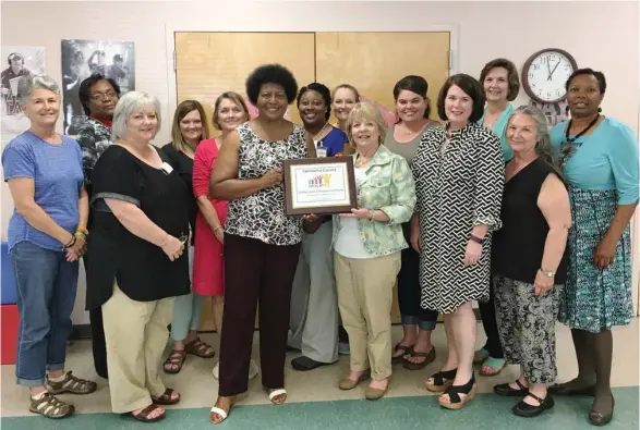  ??  ?? Members of the Oktibbeha County Excel By 5 Coalition with Excel By 5 Executive Director Eileen Beazley who presented the re-certificat­ion to the local coalition from the state Excel By 5 Board.