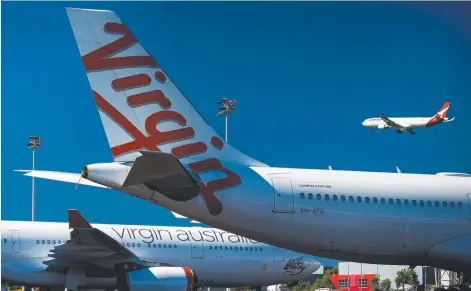  ??  ?? Virgin Australia is now in voluntary administra­tion. Picture: Patrick Hamilton/AFP