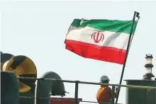  ?? Reuters ?? A crew member raises Iranian flag at Iranian oil tanker Adrian Darya 1, which was earlier named Grace 1, yesterday.