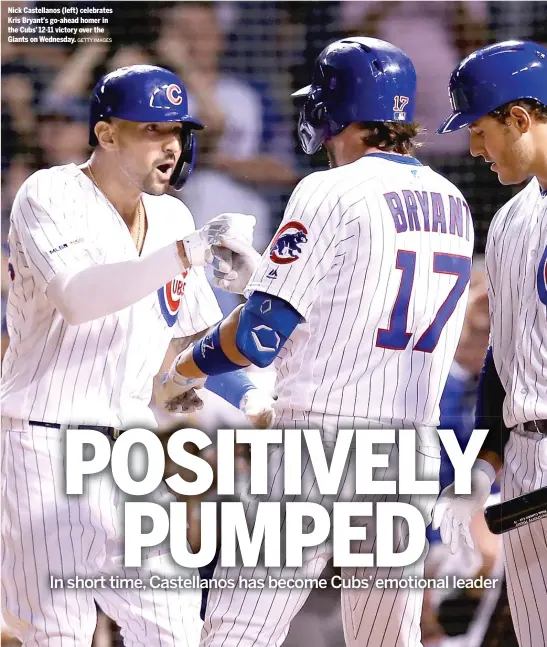  ?? GETTY IMAGES ?? Nick Castellano­s (left) celebrates Kris Bryant’s go-ahead homer in the Cubs’ 12-11 victory over the Giants on Wednesday.