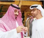  ??  ?? األمير محمد بن سلمان مع ولي عهد أبوظبي الشيخ محمد بن زايد قبل أن يرتدي إسوارة األوليمبيا­د الخاص باأللعاب العالمية المزمع إقامتها في أبوظبي العام القادم.