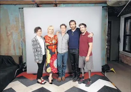  ?? Jay L. Clendenin Los Angeles Times ?? THE “STRONGER” crew at the Toronto Internatio­nal Film Festival: actors Tatiana Maslany, left, and Miranda Richardson, director David Gordon Green, actor Jake Gyllenhaal and the movie’s subject, Jeff Bauman, whose legs were amputated because of injuries.