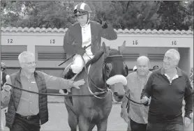  ?? Picture: Candiese Marnewick ?? From left to right Peter Gibson, Tony Dickinson and Michael Heron lead in WEALTHY after he had won the Listed Michael Roberts Handicap with regular pilot Sean Veale in the irons.