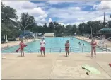  ?? PHOTO COURTESY OF LANSDALE PARKS AND RECREATION ?? Lifeguards wear masks and stand 6 feet apart on the deck of Fourth Street Pool in Lansdale on the first day of the pool’s 2020 season on July 1.