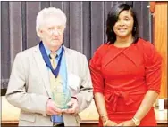  ?? ?? Former East Mississipp­i Community College basketball player Max Johnson, left, stands with EMCC Athletic Director Sharon Thompson at the Mississipp­i Community and Junior College Sports Hall of Fame induction ceremony recently. (Submitted photo)