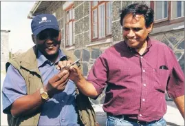  ?? PICTURES: SHANNON EBRAHIM ?? FREEDOM KEY: Above: Ebrahim Ebrahim after receiving the master key of Robben Island from Paul Langa. BELOW: Ebrahim opens his former cell on Robben Island.