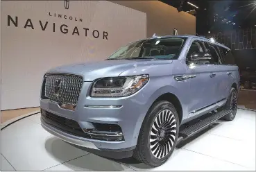  ?? Associated Press photos ?? The 2018 Lincoln Navigator is photograph­ed while on display at the New York Internatio­nal Auto Show in the Jacob Javits Center in New York earlier this year.