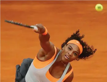  ?? — AP ?? Serena Williams serves to Sloane Stephens during their Madrid Open second round match on Monday. Serena won 6- 4, 6- 0.