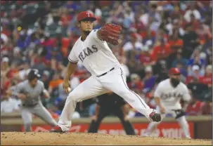  ?? The Associated Press ?? END OF AN ERA: Pitcher Yu Darvish, shown here playing for Texas in a game against the Miami Marlins, was acquired by the Los Angeles Dodgers in a trade Monday. Darvish was 52-39 with a 3.42 ERA in 122 starts for the Rangers.