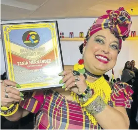  ?? ?? Poet and folklorist Tania Hernandez is ecstatic about her Atlanta Caribbean Community Award.