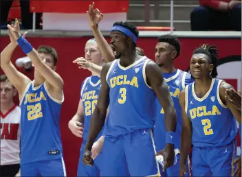  ?? CHRIS GARDNER — GETTY IMAGES ?? Adem Bona (3) and Dylan Andrews, right, played well but the rest of the Bruins didn't in Thursday's 94-77loss at