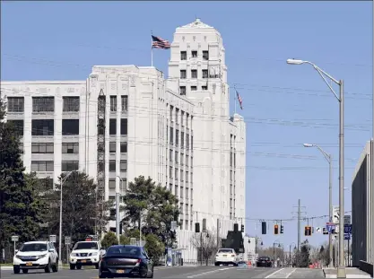  ?? Photos by Will Waldron / Times Union ?? Riverview Center on Broadway in Menands will be sold at auction last month. The building, formerly a Montgomery Ward retail store, has nearly 1 million square feet of space.