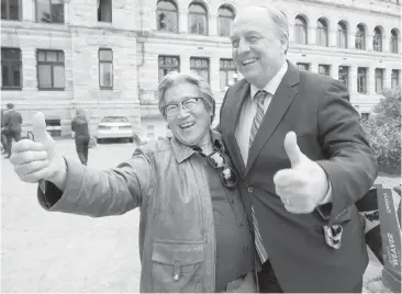  ?? DARREN STONE, TIMES COLONIST ?? B.C. Green Party Leader Andrew Weaver celebrates with Richmond-Steveston candidate Roy Sakata at the B.C. legislatur­e building the day after the election. Lawrie McFarlane suggests that the increase in Green votes appears to have come at the expense of...