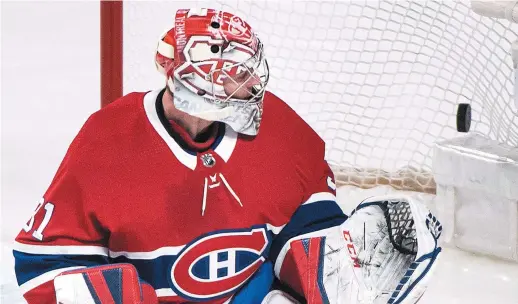  ??  ?? Le gardien du Canadien de Montréal, Carey Price, n’a pu que constater les dégâts sur un tir des Capitals de Washington, samedi. - La Presse canadienne: Graham Hughes