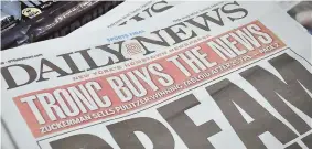  ?? AP PHOTOS ?? JUST A BUCK: The New York Daily News was purchased by Chicagobas­ed Tronc, Inc. yesterday for $1 —the cost of a single issue— along with the paper’s pension liabilitie­s, which are roughly $30 million.