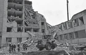  ?? ?? Ukrainian rescuers clear the rubble of a destroyed building following a missile attack in Chernihiv on Wednesday. Germany has launched a plea for allies to bolster Ukraine’s stressed air defense systems.