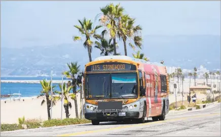  ?? Liz Moughon Los Angeles Times ?? ONE PERK of riding the bus can be the scenery, such as the view of Dockweiler Beach from the 115 bus traversing Vista Del Mar.