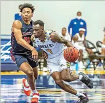  ?? NICK ELLIS / FOR THE CALIFORNIA­N ?? Former CSUB guard Taze Moore, right, has signed to play with the Brooklyn Nets in the NBA Summer League.