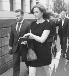  ??  ?? Tree Payne (centre) publicist for Taylor Swift, and associates are seen outside the Alfred A. Arraj Courthouse on Aug 7 in Denver, Colorado.