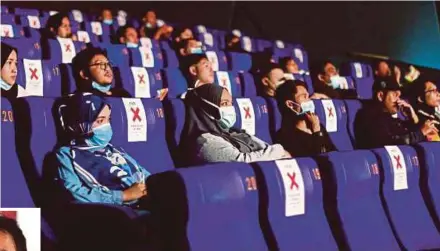  ?? FILE PIC ?? People watching a movie at a cinema in Melaka in July last year.