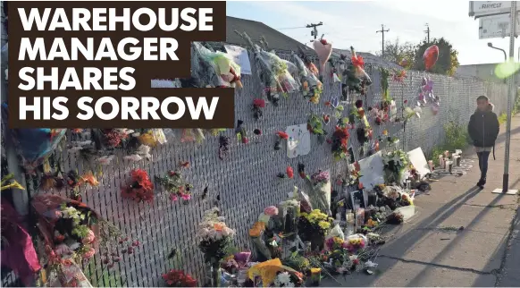  ?? MARCIO JOSE SANCHEZ, AP ?? Flowers, pictures and candles adorn a fence at a memorial near the site of the warehouse fire Tuesday in Oakland.