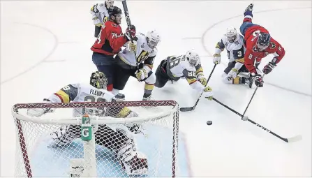  ?? GREGORY SHAMUS GETTY IMAGES ?? Alex Ovechkin, right, of the Capitals scores a goal on Vegas Golden Knights goalie Marc-Andre Fleury in the second period of Game 3.