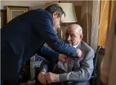  ?? — AFP photo ?? Laban presents Hausman with France’s Legion of Honor (Legion d’honneur) during a ceremony in New York.