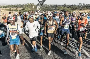  ?? /RAJESH JANTILAL/AFP ?? Runners take part in yesterday’s Comrades Marathon between Pietermari­tzburg and Durban.